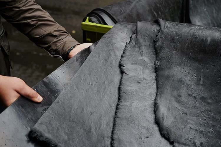 Natural rubber and synthetic rail elastomers